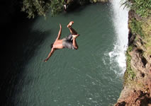 waterfall jumping: diving into the pool of the waterfalls near san blas